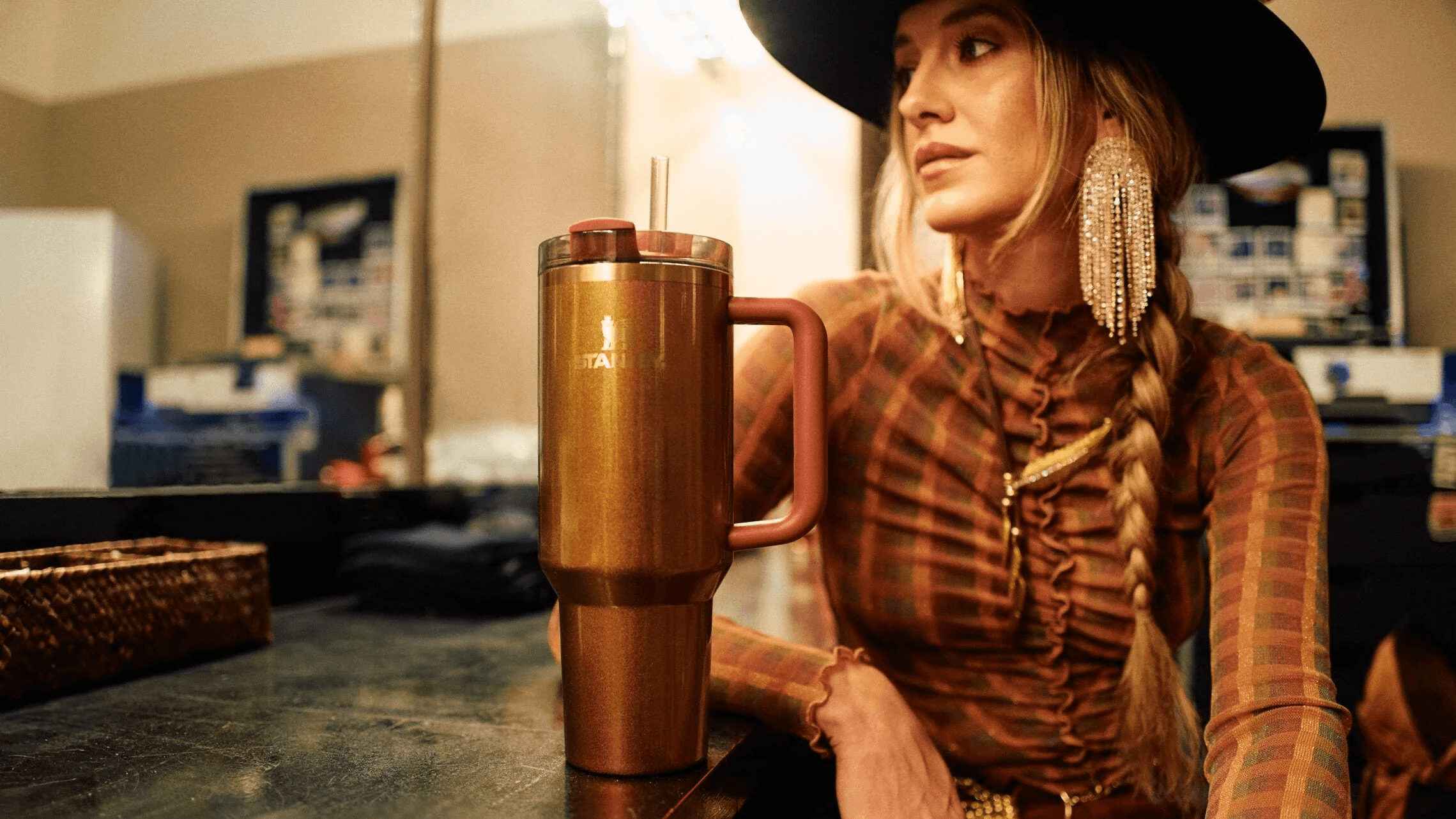 Lainey Wilson in Stanley's official Country Gold Quencher campaign imagery.