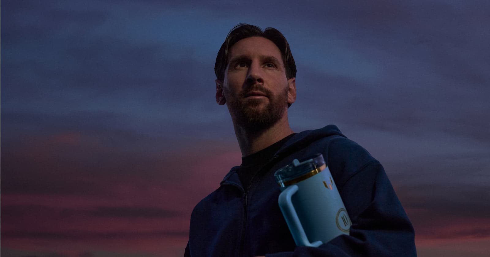 Lionel Messi holding a Stanley bottle in the official Messi × Stanley 1913 campaign.